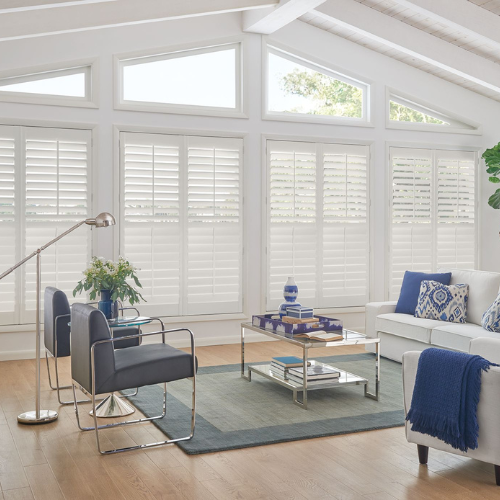 Custom plantation shutters in a residential living room.