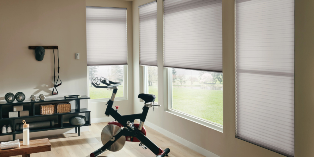Cellular shades installed in a home gym in St. Louis, MO. 