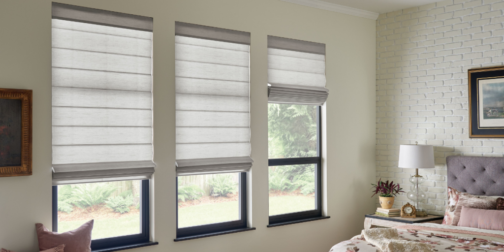 Classic Roman shades installed in a St. Louis bedroom. 