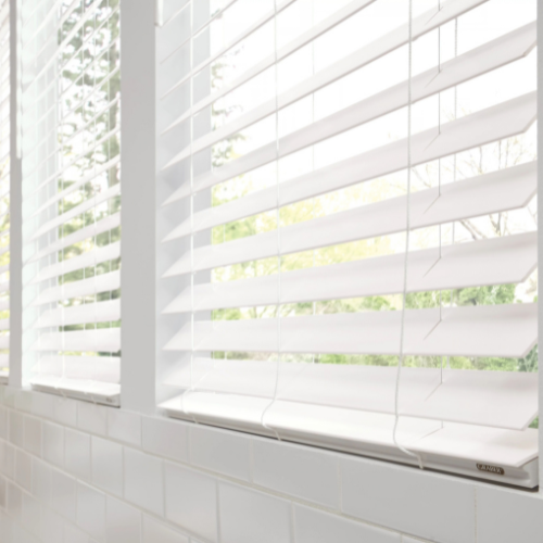 Close-up of custom faux wood blinds in a bathroom
