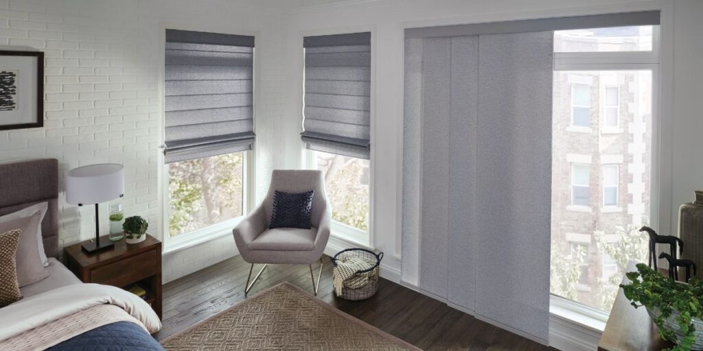 Sliding Panel shades in a residential bedroom.