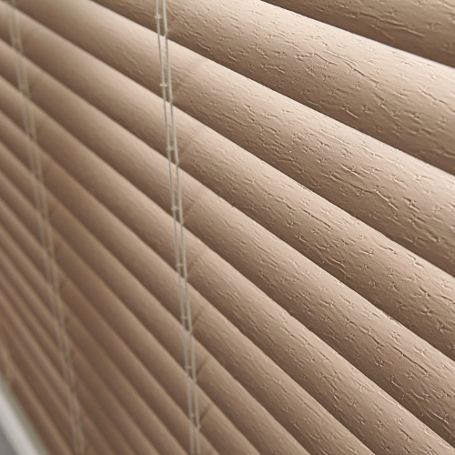 Close up of vinyl blinds in a living room