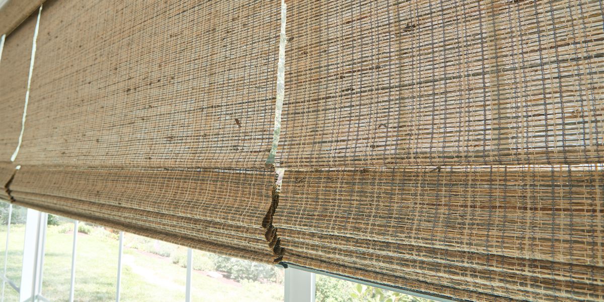 Woven shades on large picture windows in a St. Louis, Mo home.