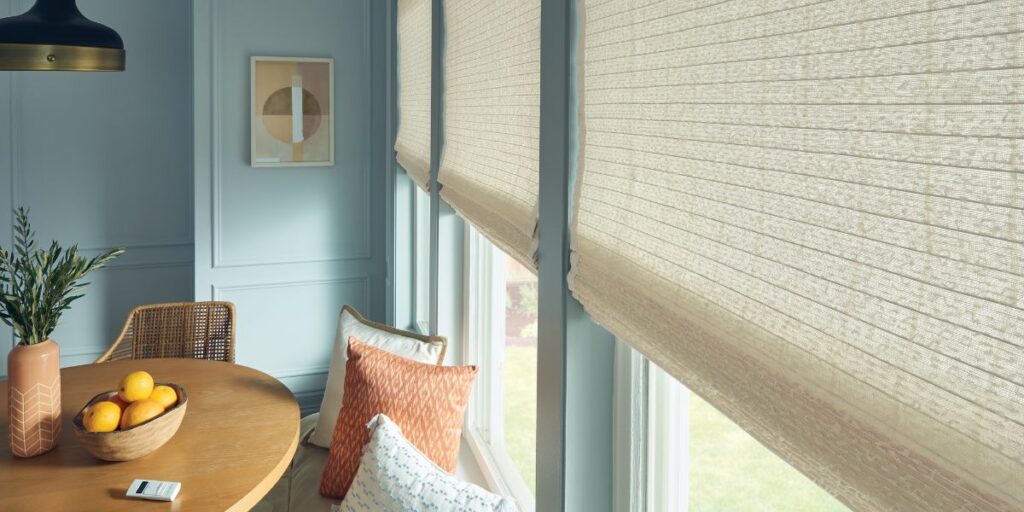 Woven window shades in a dinning room with large picture windows